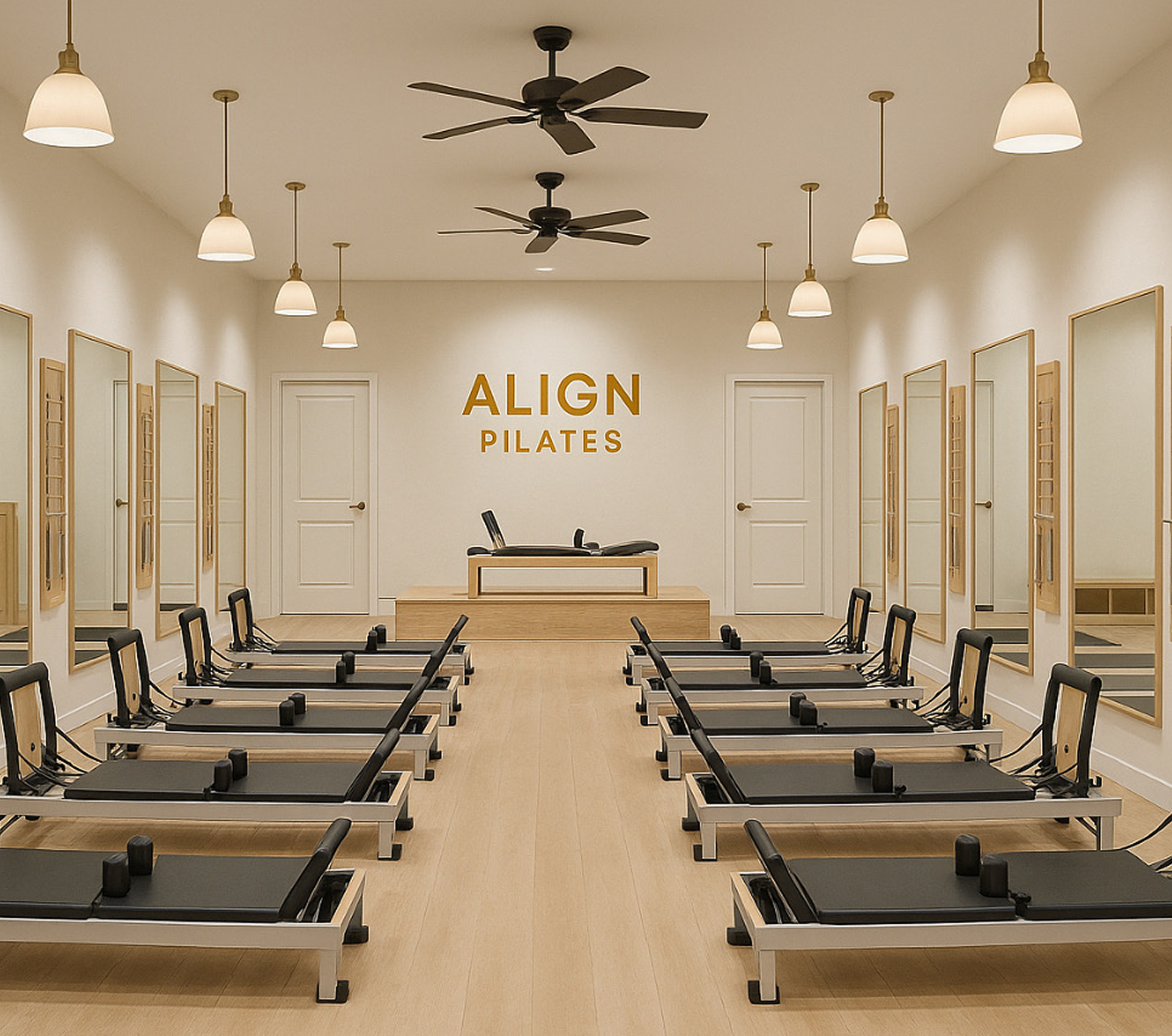 Pilates studio with reformer machines and mirrors.